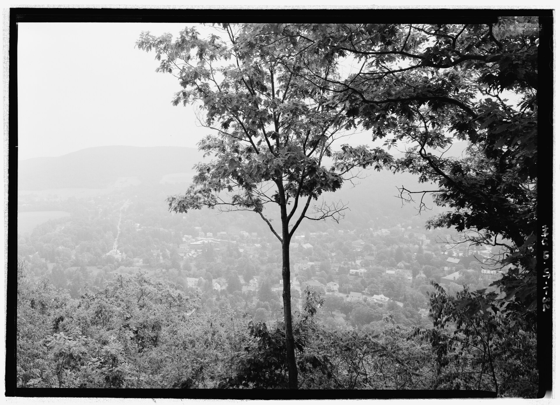 View of Woodstock Village (less distant view), looking southeast from the overlook on the south peak Carriage Road loop, in Billings Park (town of Woodstock). Billings Park is adjacent to HALS VT-1-32